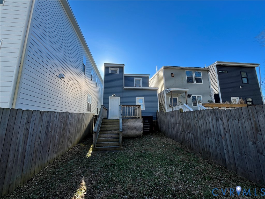 2316 R Street Richmond, VA 23223 - Photo 2 of 18 Back of house with a fenced backyard, a wooden dec