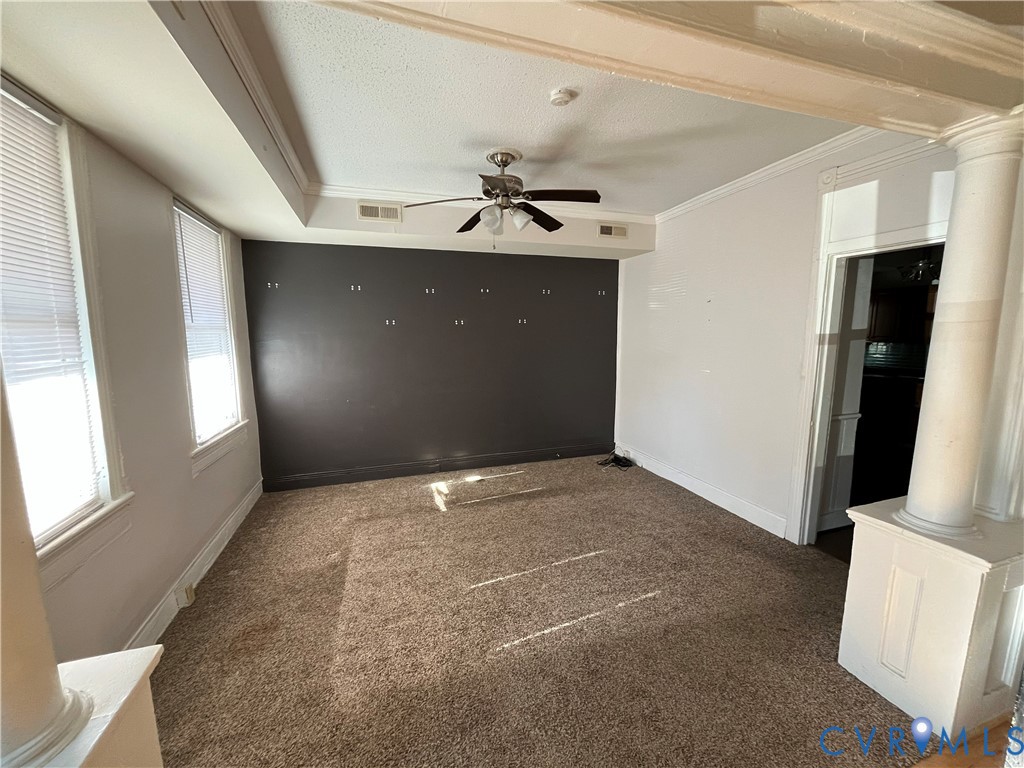 2316 R Street Richmond, VA 23223 - Photo 5 of 18 Carpeted empty room featuring crown molding, decor