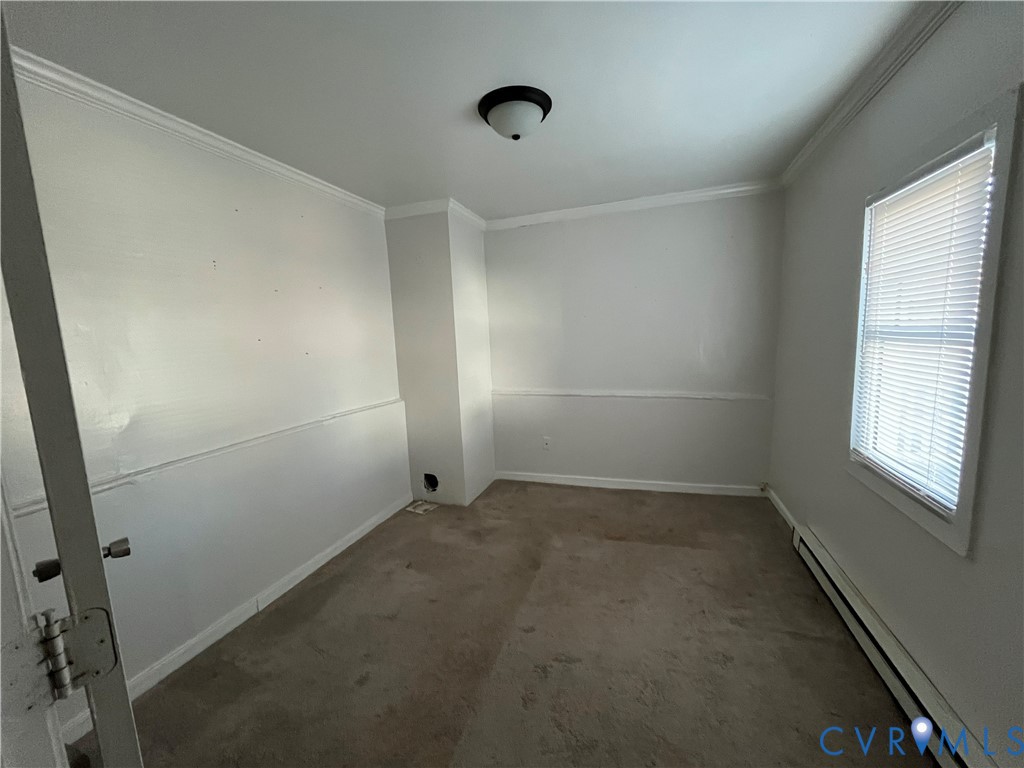 2316 R Street Richmond, VA 23223 - Photo 10 of 18 Carpeted empty room featuring baseboard heating an