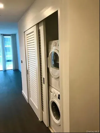a view of a hallway with washer and dryer