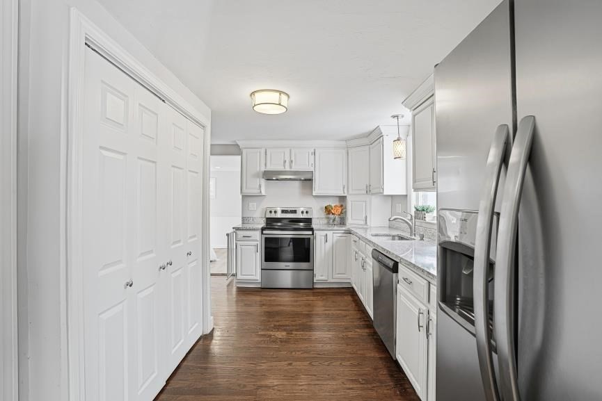 49 Grove Street Upton, MA 01568 - Photo 11 of 39 a kitchen with stainless steel appliances a refrigerator sink and cabinets