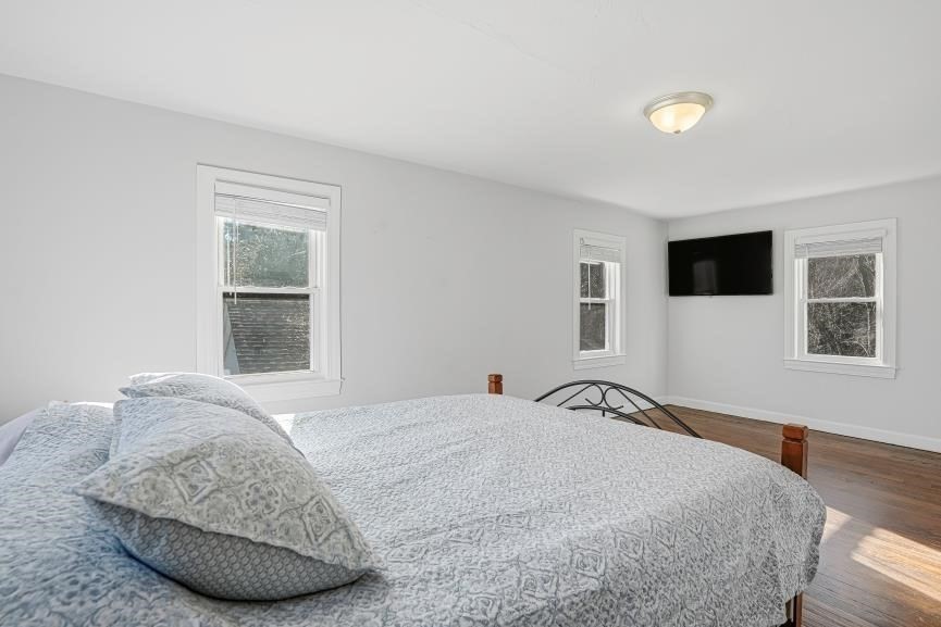 49 Grove Street Upton, MA 01568 - Photo 24 of 39 a bedroom with a large bed and a window