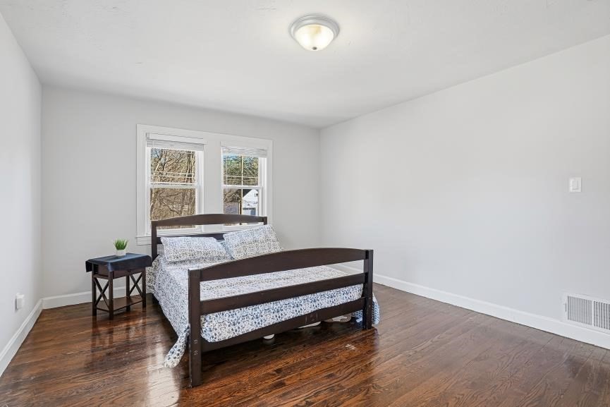 49 Grove Street Upton, MA 01568 - Photo 25 of 39 a bedroom with a bed and a desk