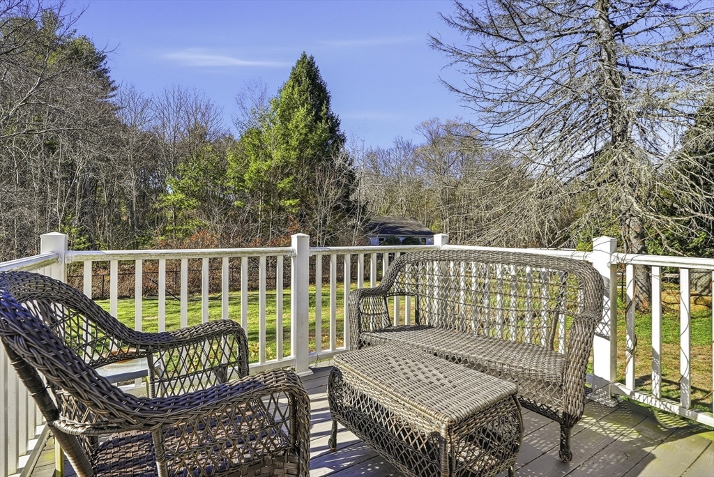 49 Grove Street Upton, MA 01568 - Photo 31 of 39 a view of a chair and table on the deck