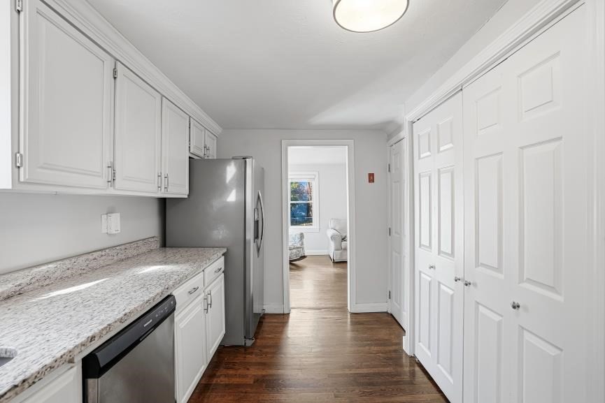 49 Grove Street Upton, MA 01568 - Photo 9 of 39 a view of a kitchen with a sink