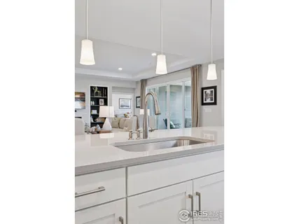 a bathroom with a sink a mirror and shower