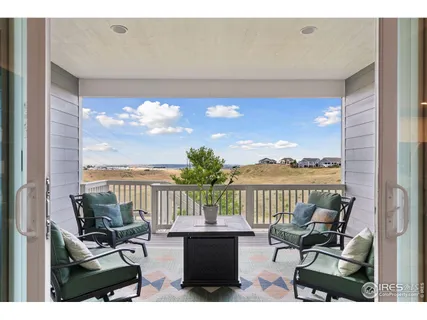 a view of a balcony with lake view and mountain view