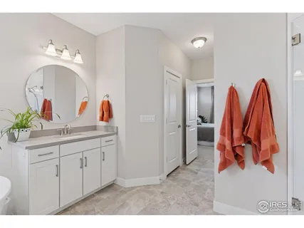 a view of a bathroom sink mirror and vanity