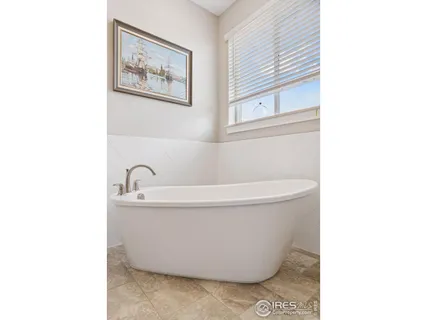 a white bath tub sitting in a bathroom