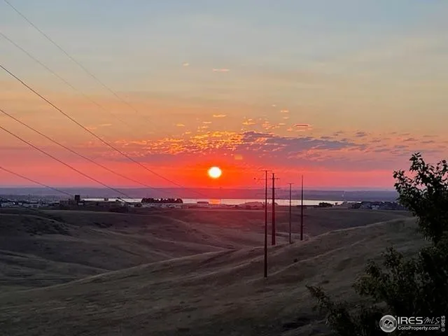 a view of a backyard with wooden fence