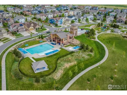 a view of a park with swings and slides