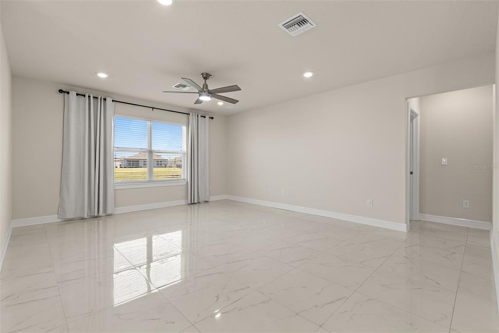 9256 Royal River Circle Parrish, FL 34219 - Photo 14 of 38 an empty room with windows and fan