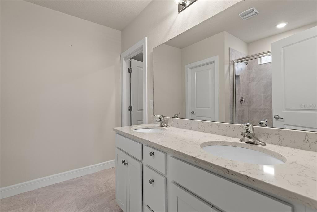 9256 Royal River Circle Parrish, FL 34219 - Photo 18 of 38 a bathroom with a sink and a mirror