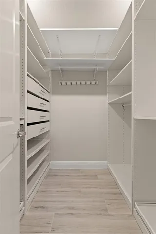 a view of an empty walk in closet