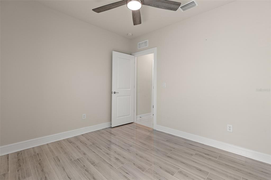9256 Royal River Circle Parrish, FL 34219 - Photo 24 of 38 wooden floor in an empty room