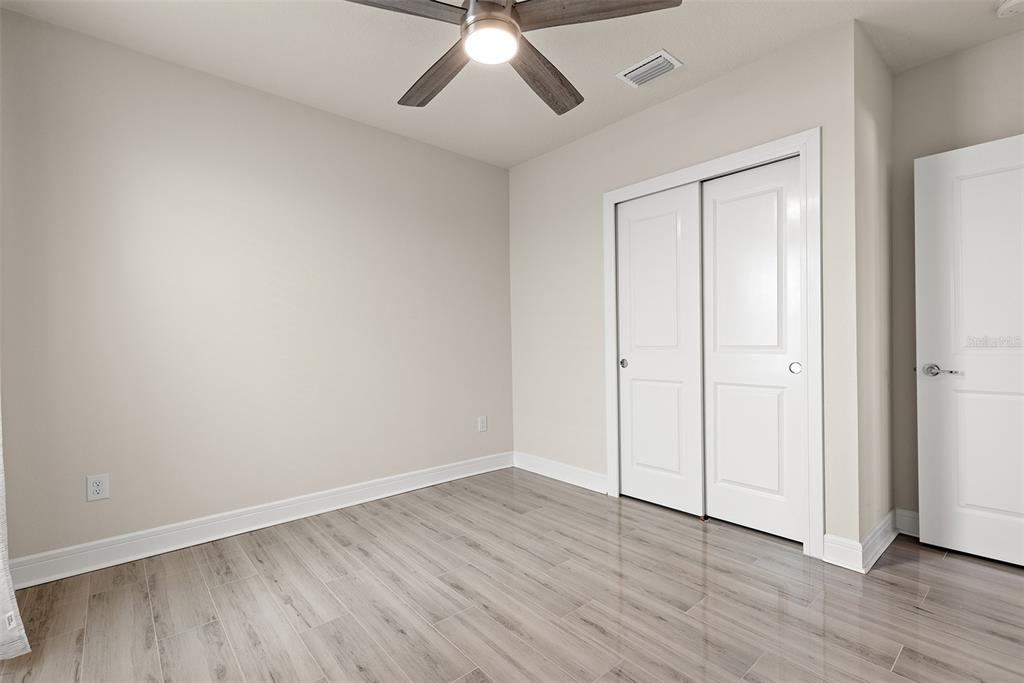 9256 Royal River Circle Parrish, FL 34219 - Photo 27 of 38 a view of an empty room with wooden floor