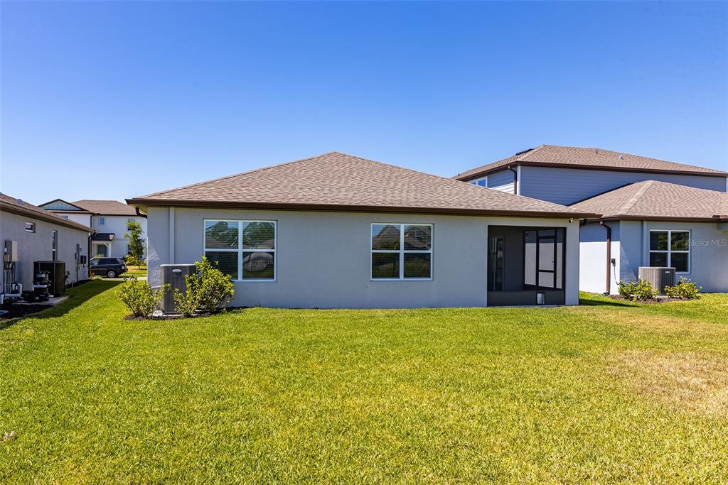 9256 Royal River Circle Parrish, FL 34219 - Photo 32 of 38 a view of a house with a yard