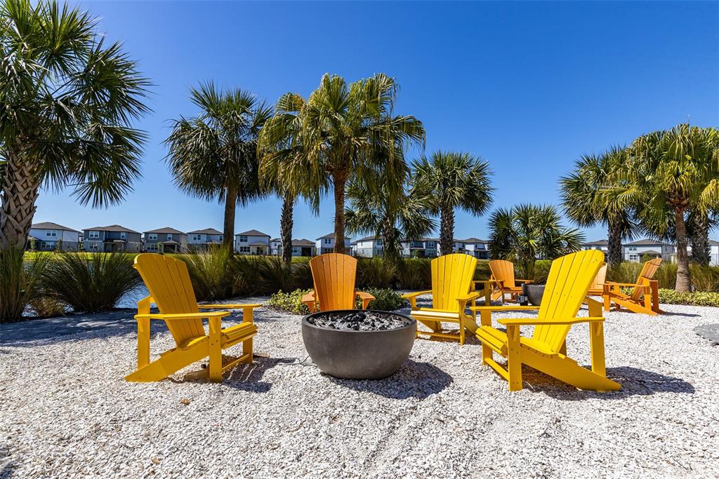 9256 Royal River Circle Parrish, FL 34219 - Photo 38 of 38 a view of a swimming pool with a chair and potted plants