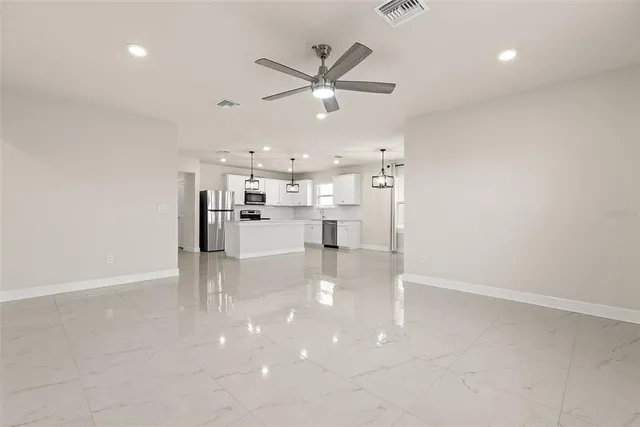 a view of work space with wooden floor and windows