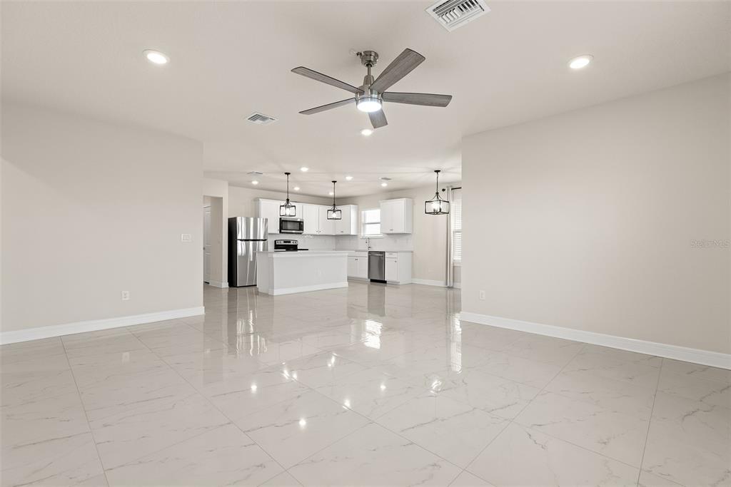 9256 Royal River Circle Parrish, FL 34219 - Photo 5 of 38 a view of work space with wooden floor and windows