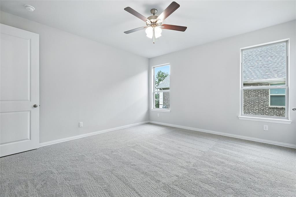 509 Hummingbird Lane Van Alstyne, TX 75495 - Photo 13 of 40 wooden floor in an empty room with a window