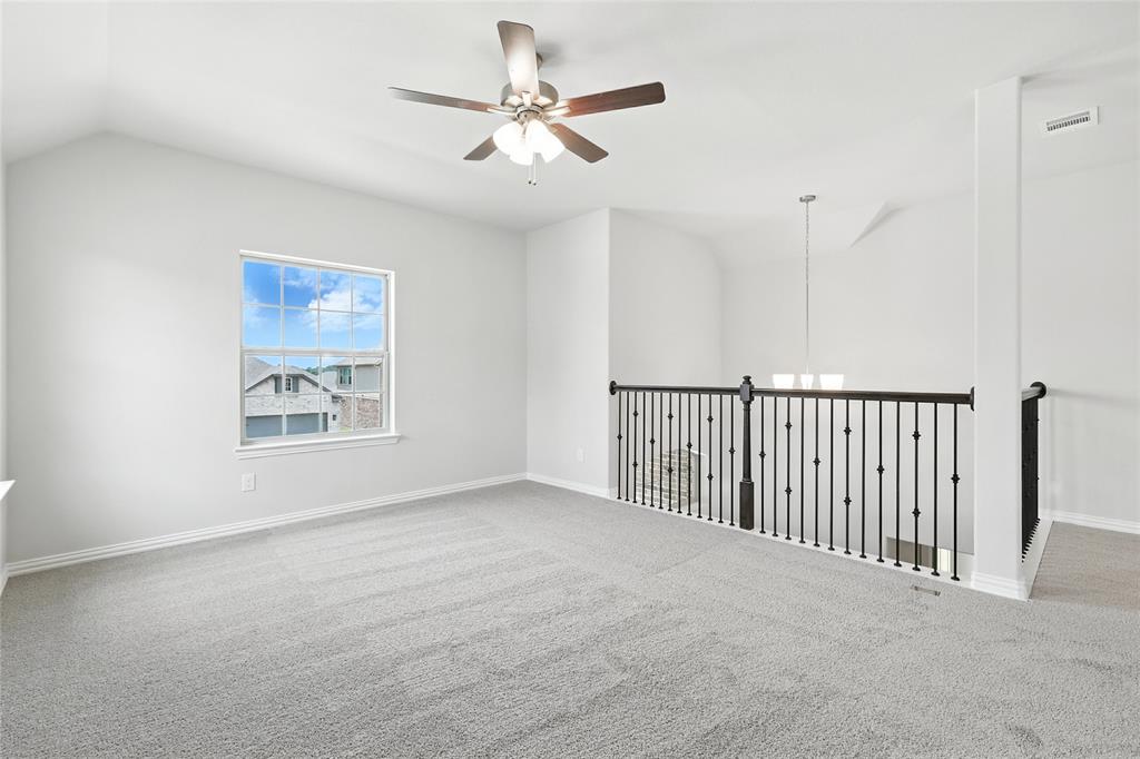 509 Hummingbird Lane Van Alstyne, TX 75495 - Photo 23 of 40 a view of a livingroom with a ceiling fan
