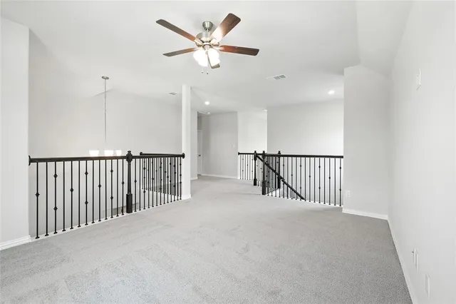 a view of a livingroom with a ceiling fan