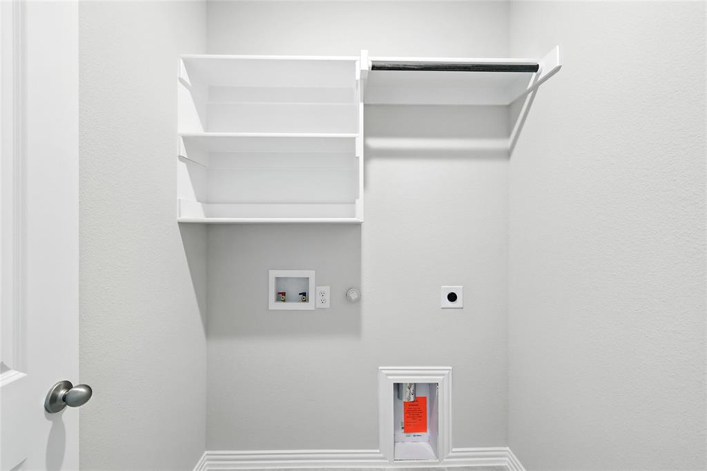 509 Hummingbird Lane Van Alstyne, TX 75495 - Photo 26 of 40 a view of small space with racks on the wall