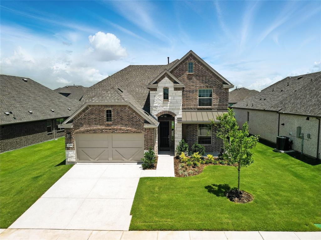 509 Hummingbird Lane Van Alstyne, TX 75495 - Photo 31 of 40 a front view of a house with a yard