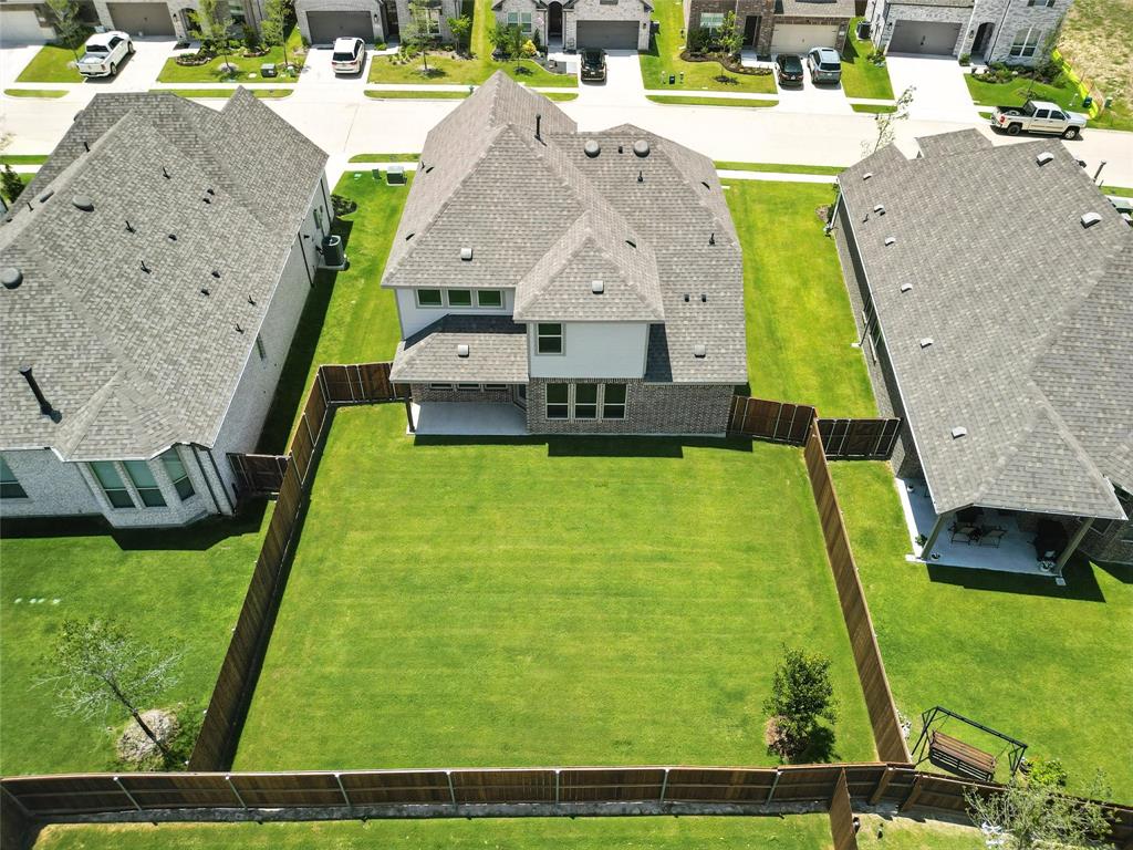 509 Hummingbird Lane Van Alstyne, TX 75495 - Photo 32 of 40 a view of a swimming pool with a yard