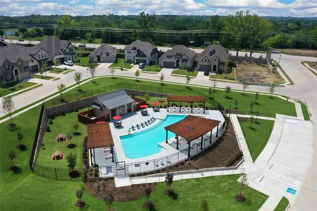 a view of a swimming pool with a yard