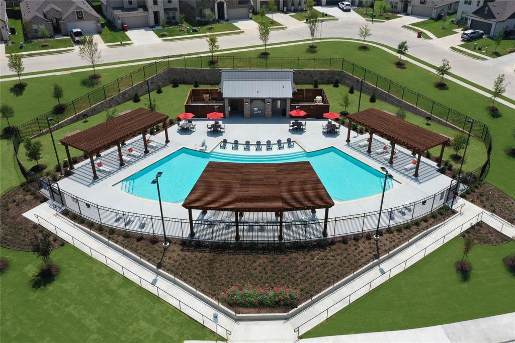 509 Hummingbird Lane Van Alstyne, TX 75495 - Photo 34 of 40 a view of a swimming pool with a patio and a yard