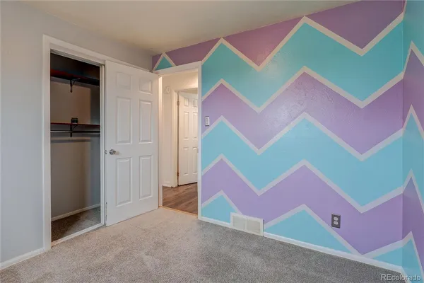 a bedroom with a bed and a room