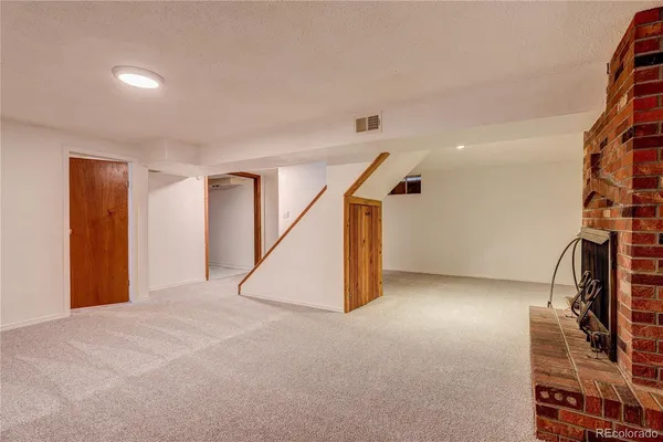 a view of an empty room with stairs