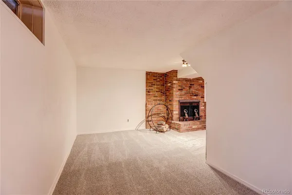 a view of a room with a fireplace