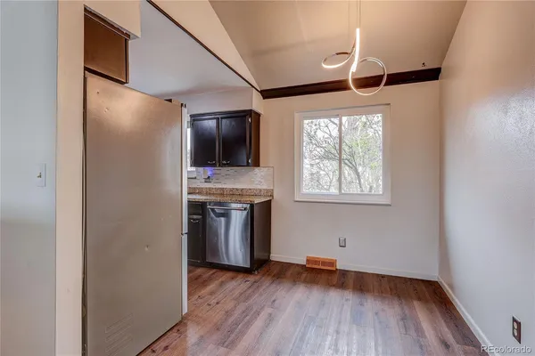 a view of kitchen with sink microwave refrigerator and outdoor space