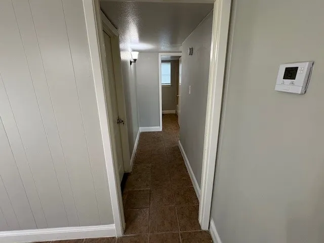 en empty room with windows and closet