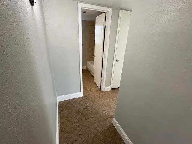 a bathroom with a sink toilet and mirror