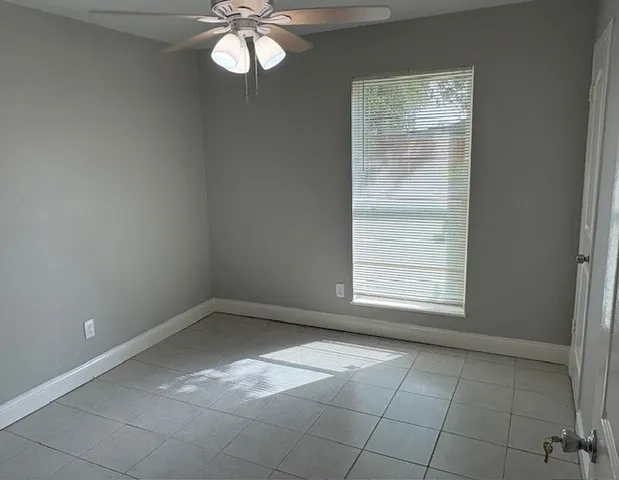 an empty room with a bathroom