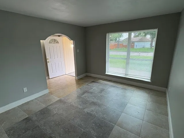 a view of a big room with closet and wooden door