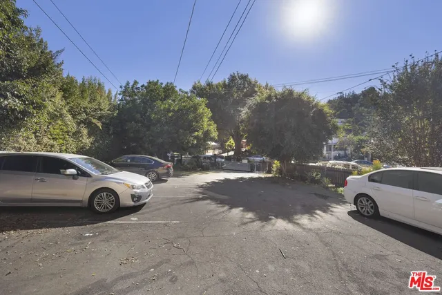 a view of a car parked in front of a house