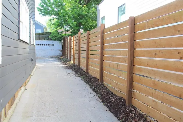 a view of a pathway with a building in the background