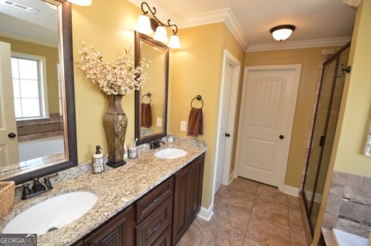 300 Grand Reserve Way Kathleen, GA 31047 - Photo 14 of 24 a bathroom with a granite countertop sink and a mirror