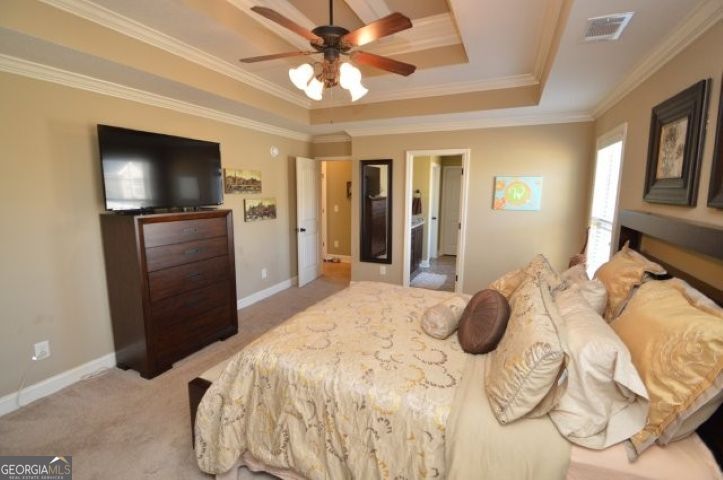 300 Grand Reserve Way Kathleen, GA 31047 - Photo 16 of 24 a bedroom with a bed and a flat screen tv