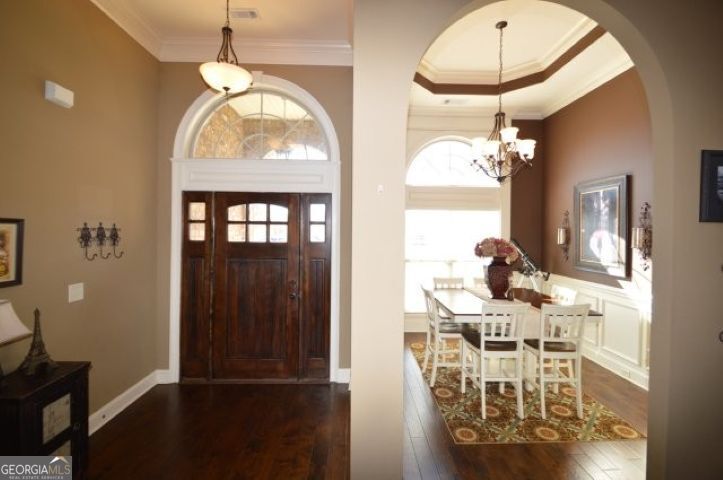 300 Grand Reserve Way Kathleen, GA 31047 - Photo 2 of 24 a view of a dining room with furniture and chandelier