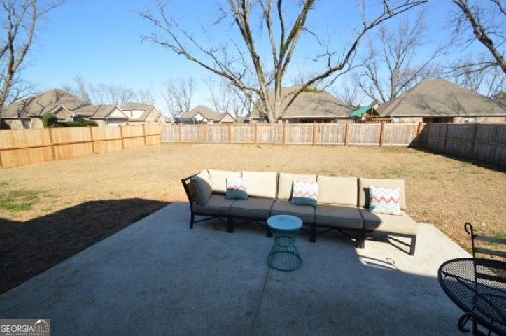 300 Grand Reserve Way Kathleen, GA 31047 - Photo 22 of 24 a roof deck with couches and potted plants