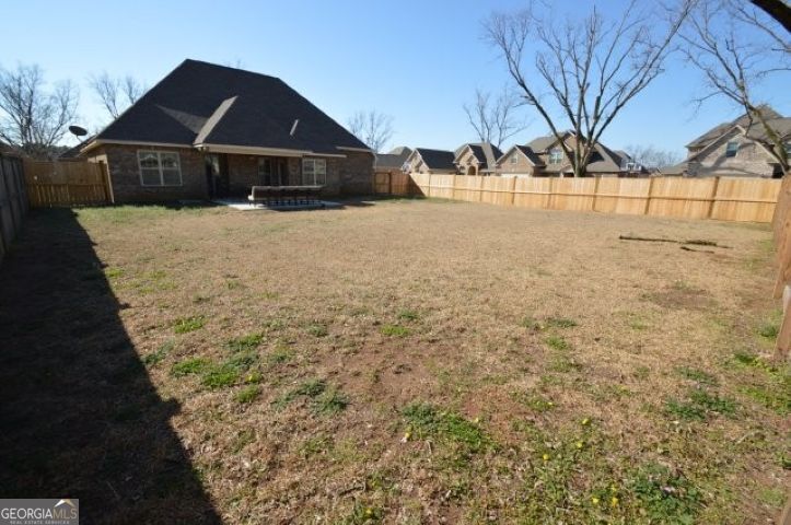 300 Grand Reserve Way Kathleen, GA 31047 - Photo 23 of 24 a view of a white house with a yard