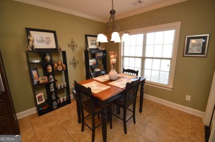 300 Grand Reserve Way Kathleen, GA 31047 - Photo 9 of 24 a dining room with furniture and window