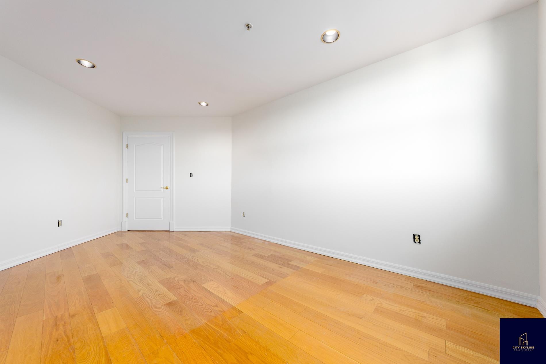 19-19 24th Avenue, Unit L607 Queens, NY 11102 - Photo 12 of 15 a view of empty room