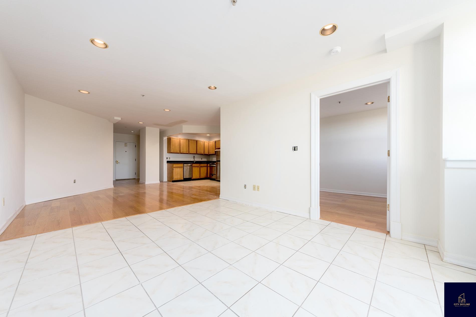 19-19 24th Avenue, Unit L607 Queens, NY 11102 - Photo 9 of 15 a view of an empty room